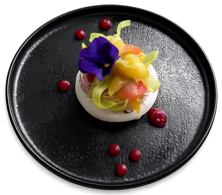 Pavlova aux fruits exotiques et fleur comestible, dessert de la carte au restaurant L'Hémicycle Toulouse rive gauche